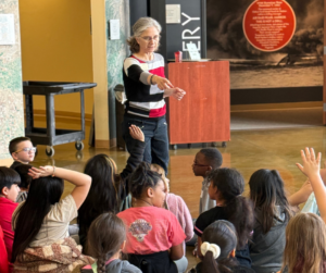 Education Manager, Pauline Schafer, interacting with local elementary students on a field trip to the museum